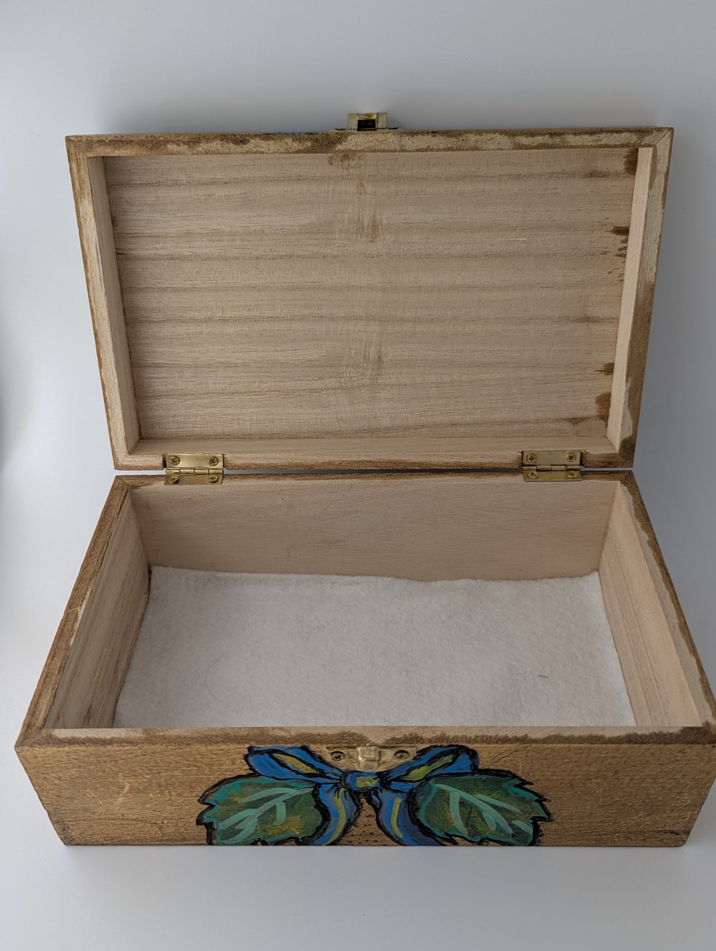 Interior of a wooden box with floral design