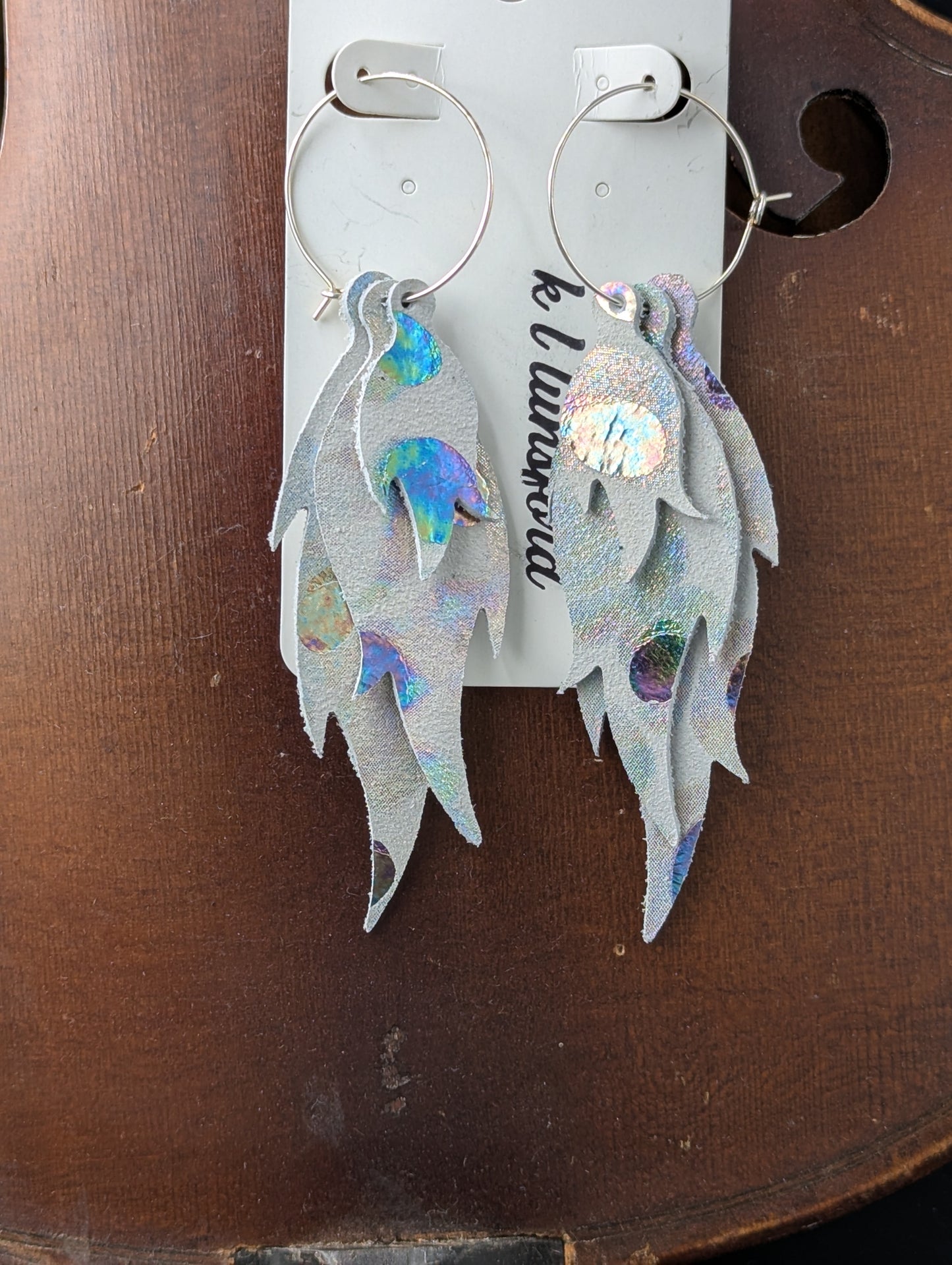 Leather flame shaped earrings. Light gray with delicate iridescent drops. 4 inches long.