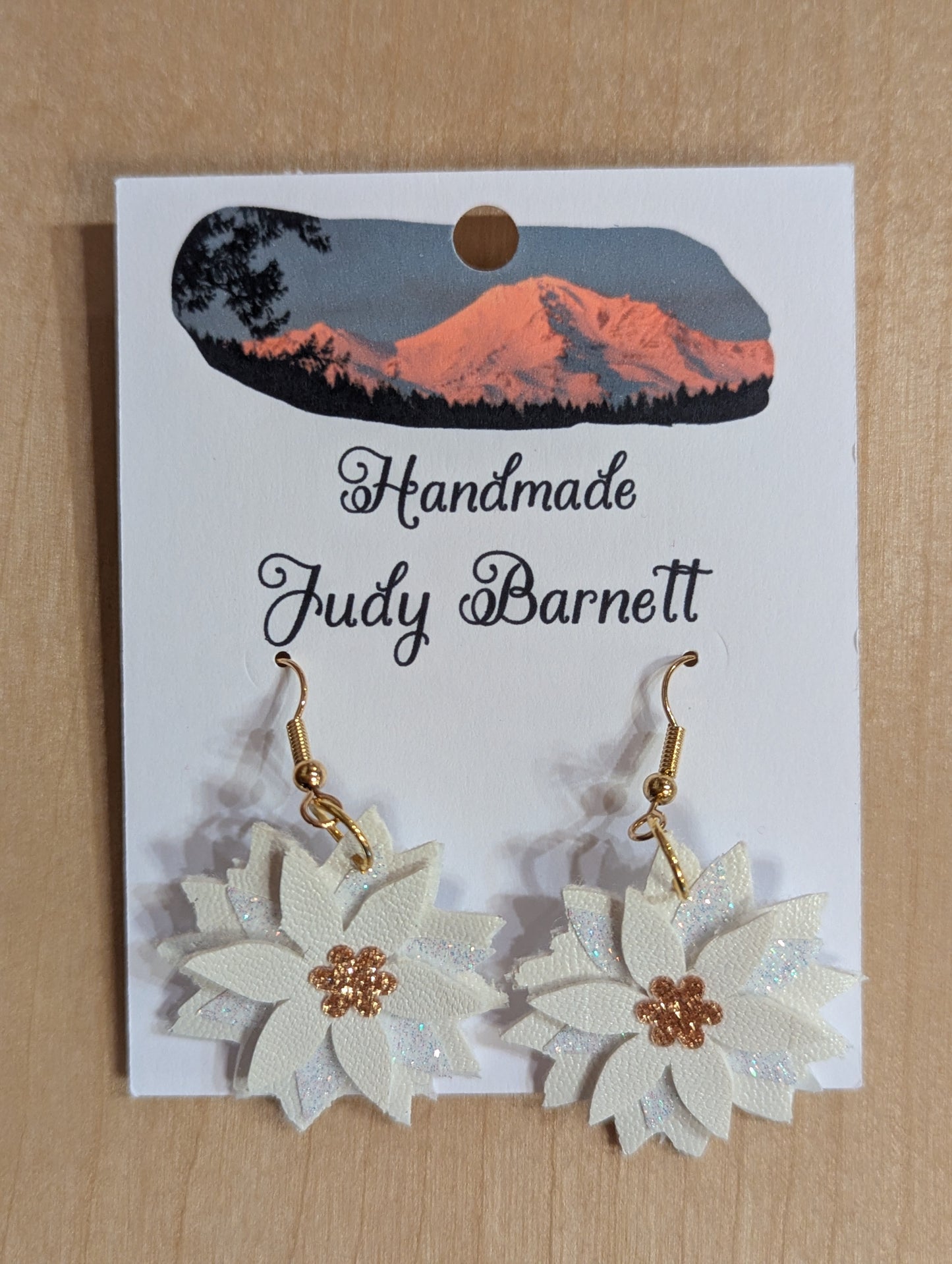 White poinsettia earrings with gold hooks