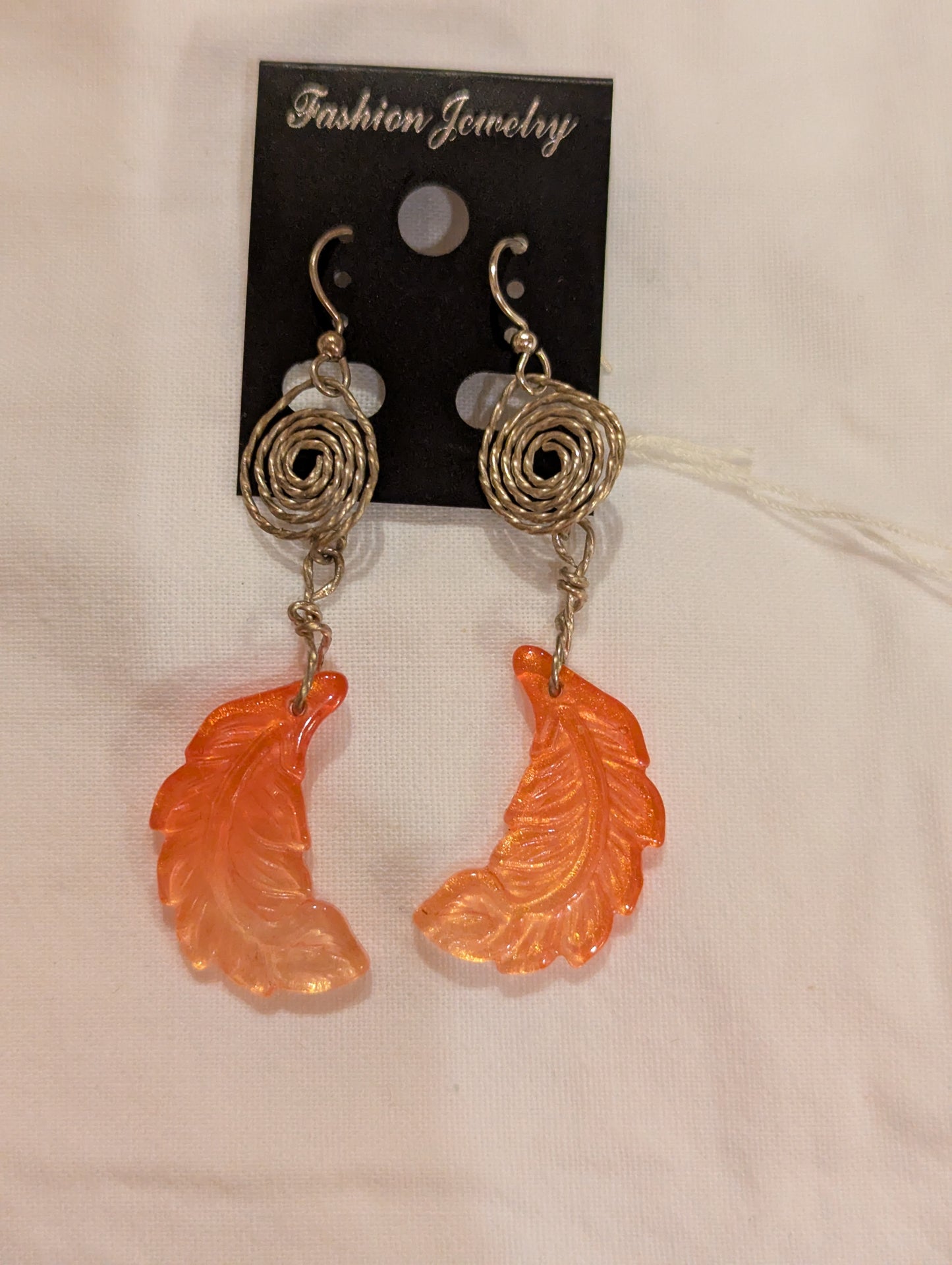 Earrings: Peach feathers