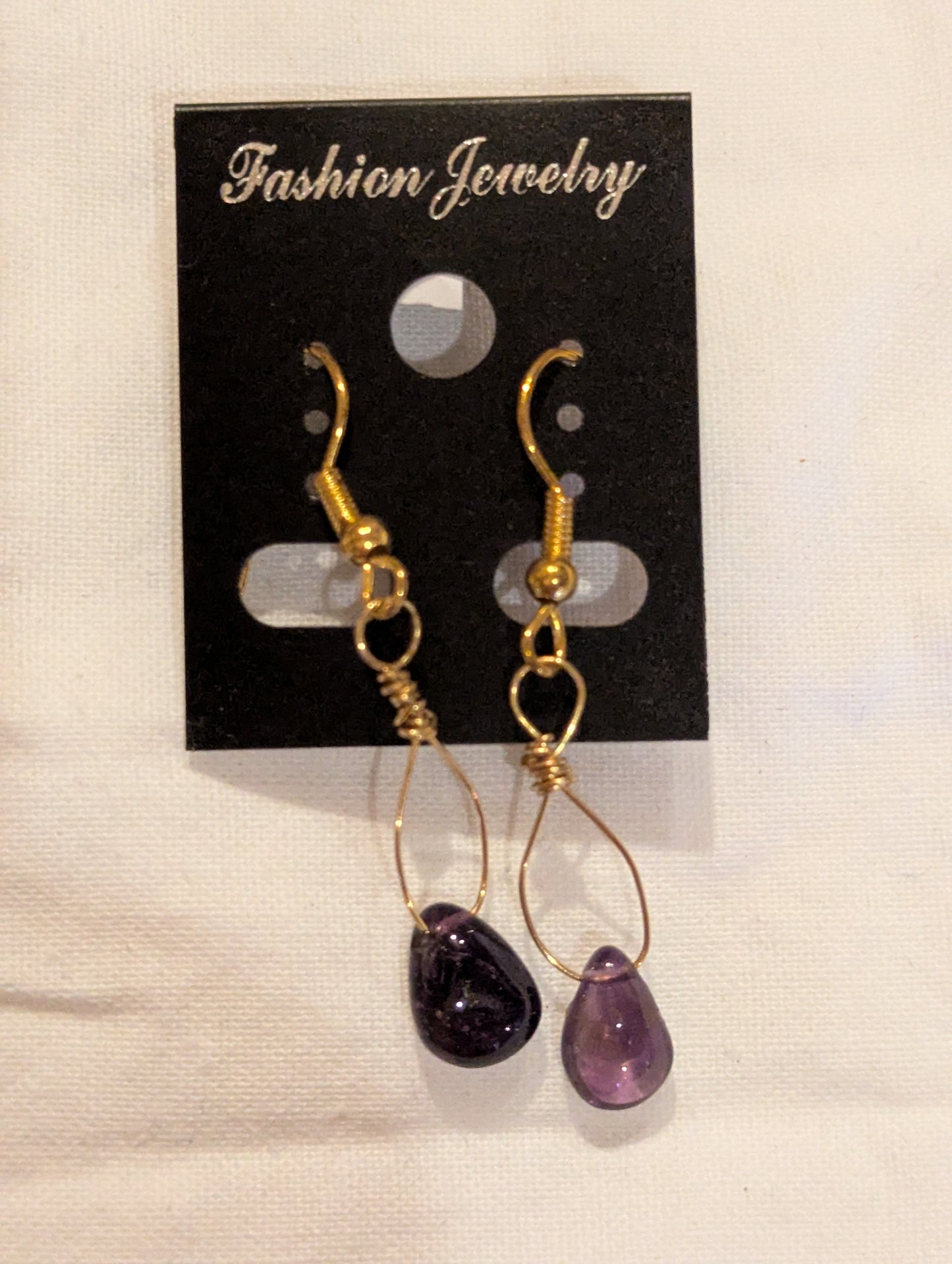Earrings: Gold and amethyst drops