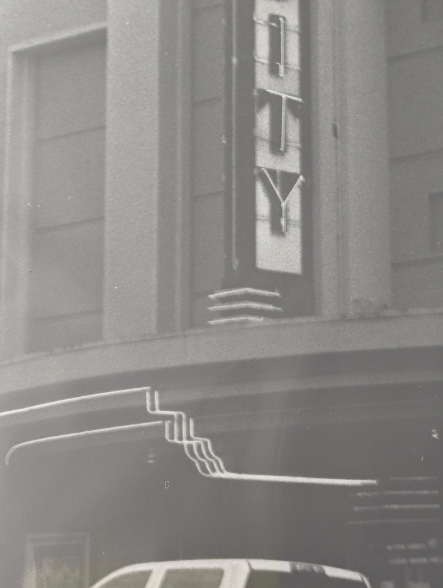 Close up of a black and white photo of the Varsity Theater in Ashland, Oregon
