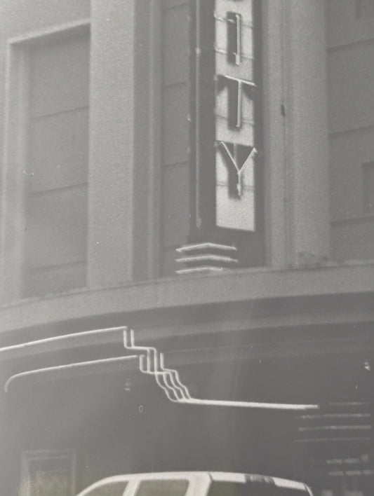 Close up of a black and white photo of the Varsity Theater in Ashland, Oregon