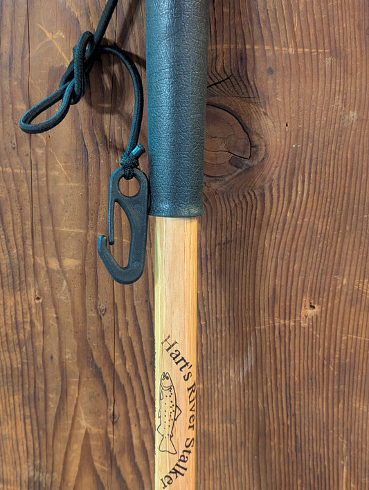 Detail of the handle of a handcrafted fly fishing accessory to stabilize you while walking in water.