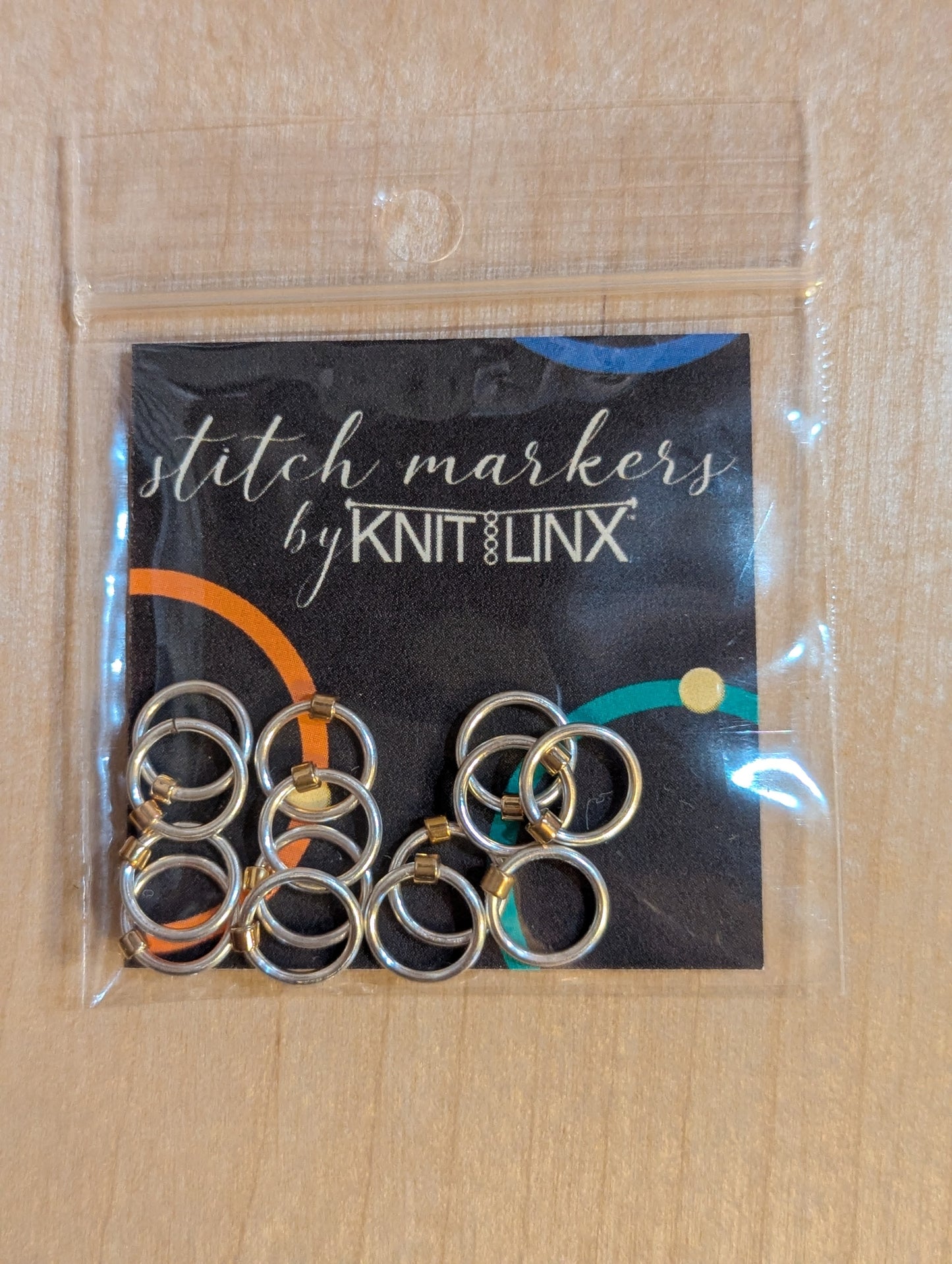 Knitting and crochet stitch markers by KnitLinx for knitting needles size 0 through 8. Made from metal and silver color.