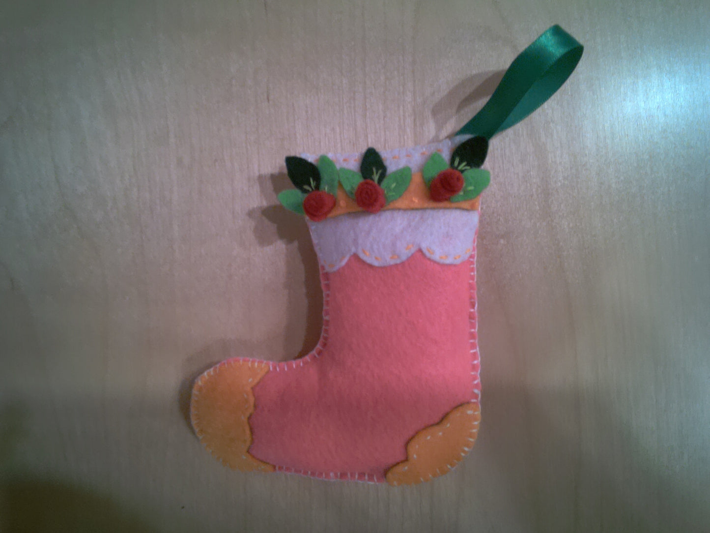 Vintage style stocking ornament with green ribbon hanger