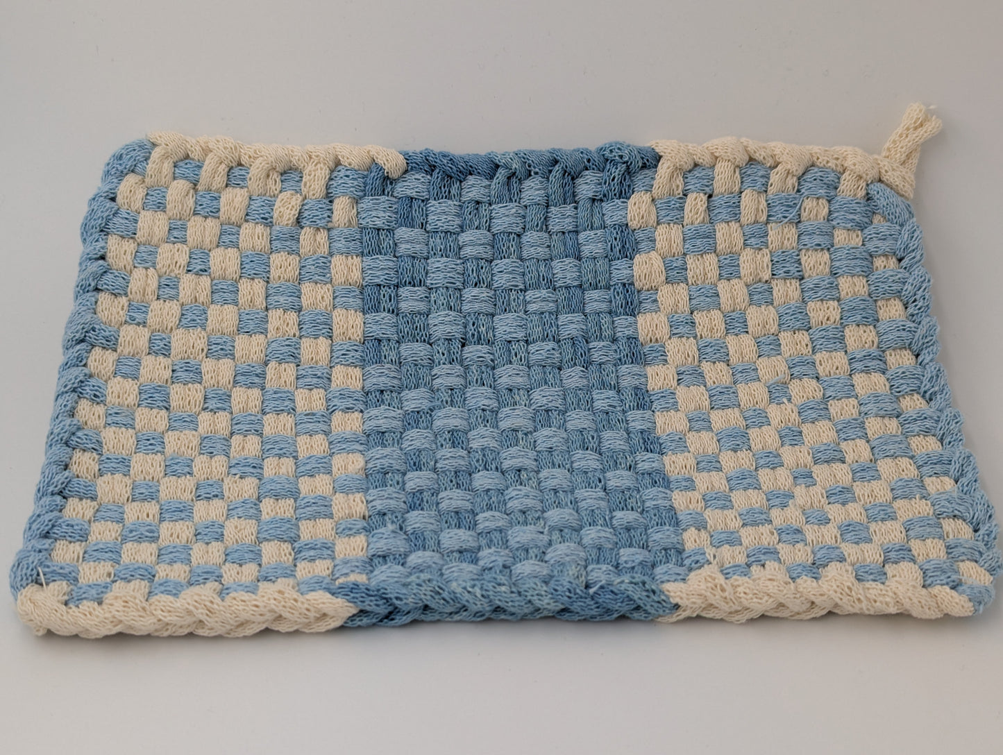 Oversize handwoven potholder in shades of blue and cream