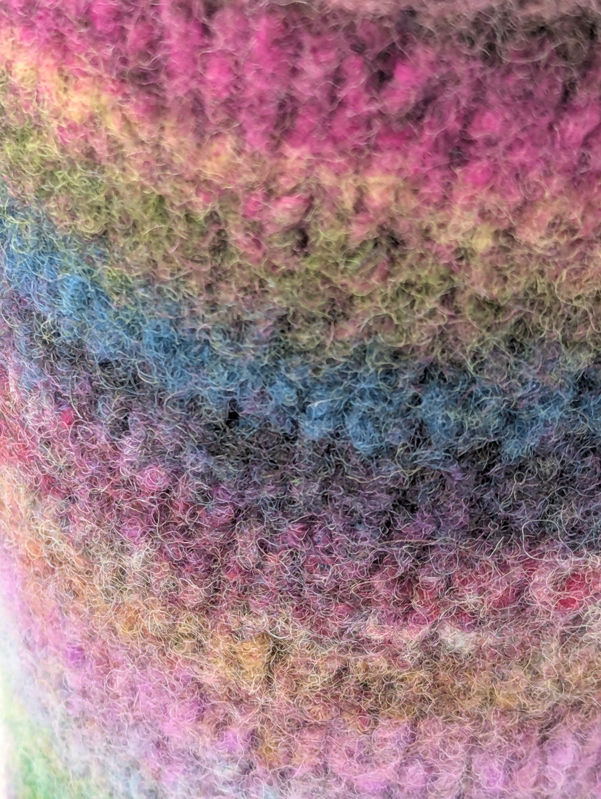Close-up of a colorful striped mug cozy 
