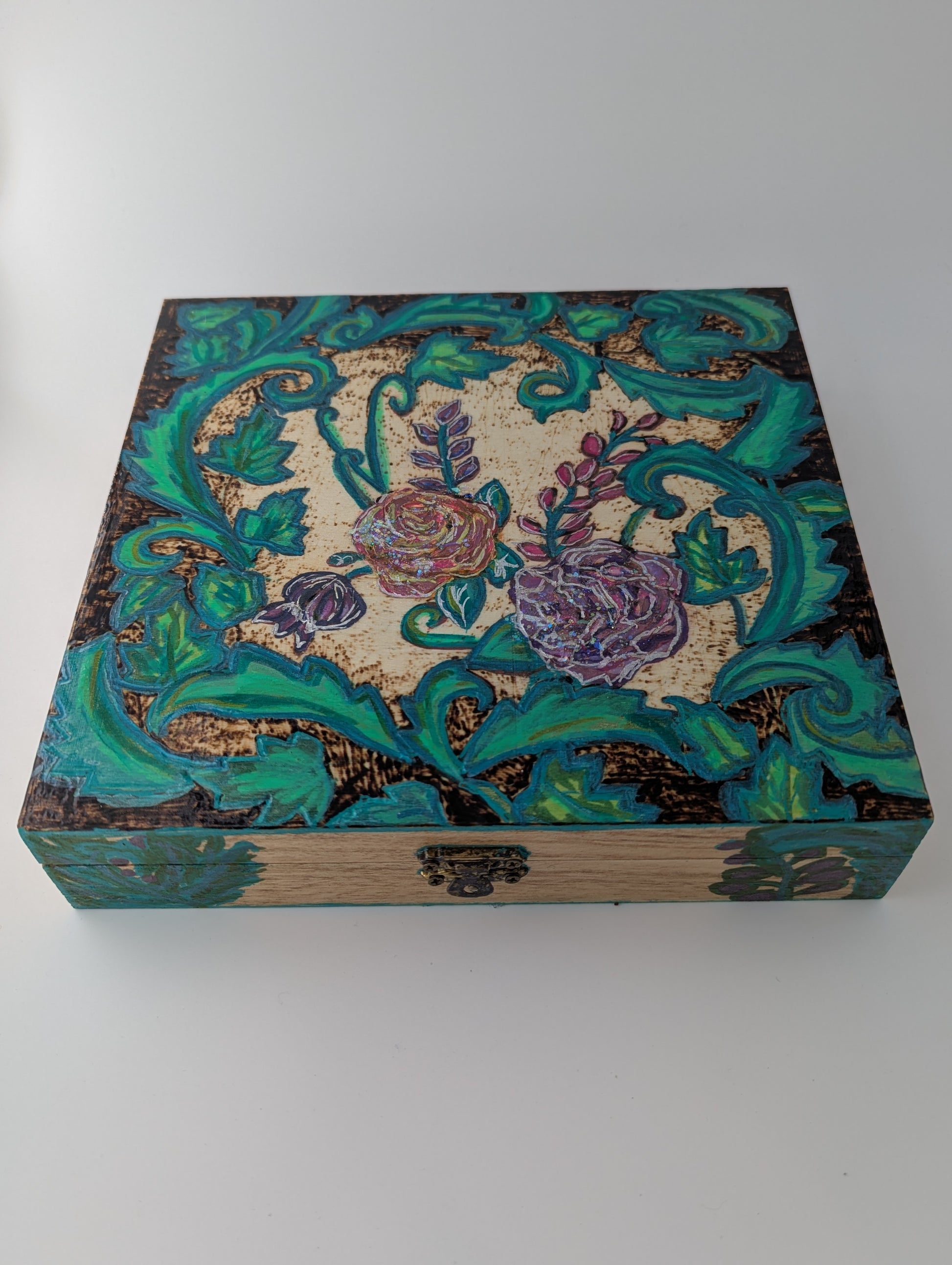 Decorative wooden box with floral pattern