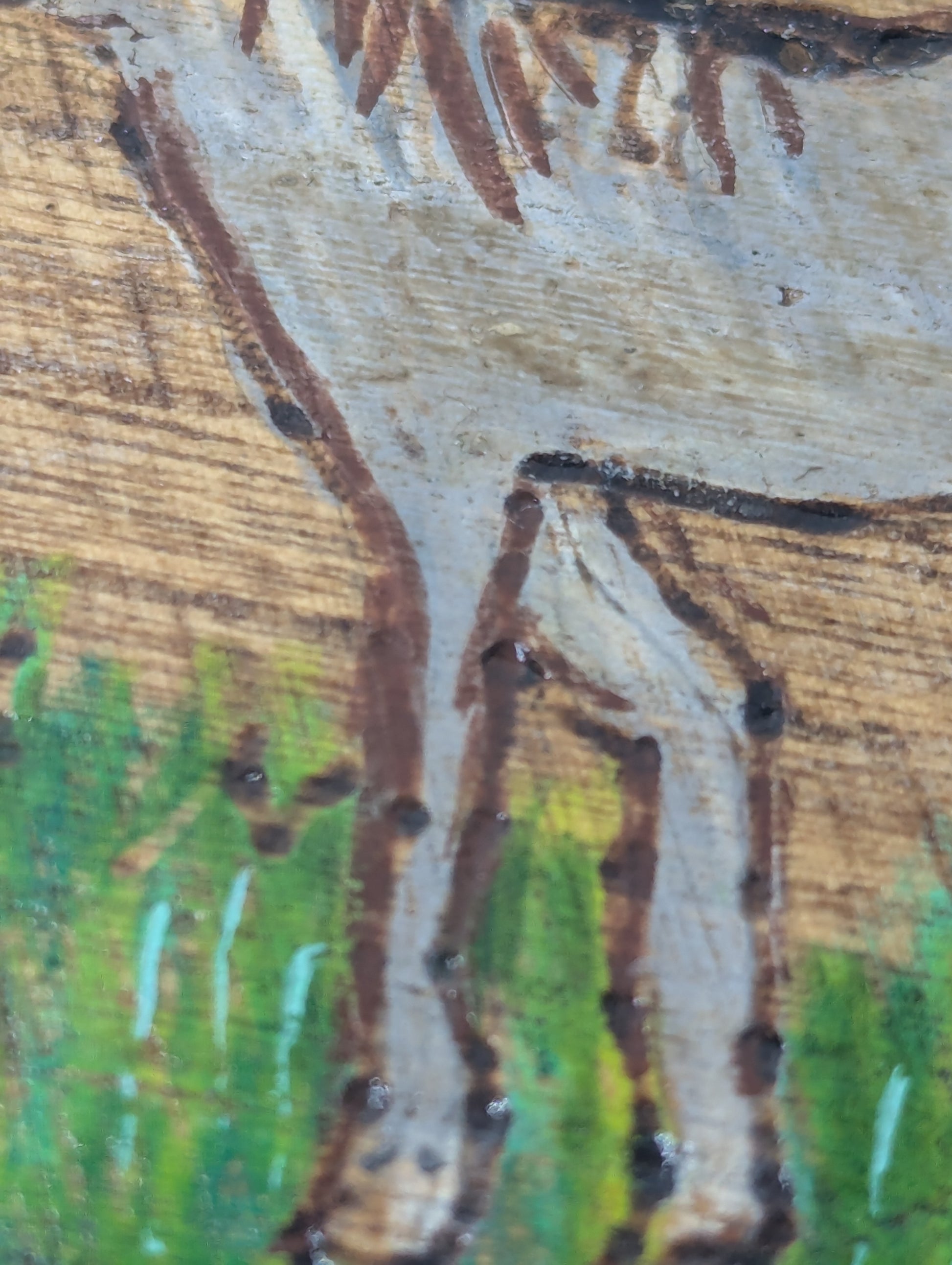 Close up of a decorative round wooden box with a tole painted horse 