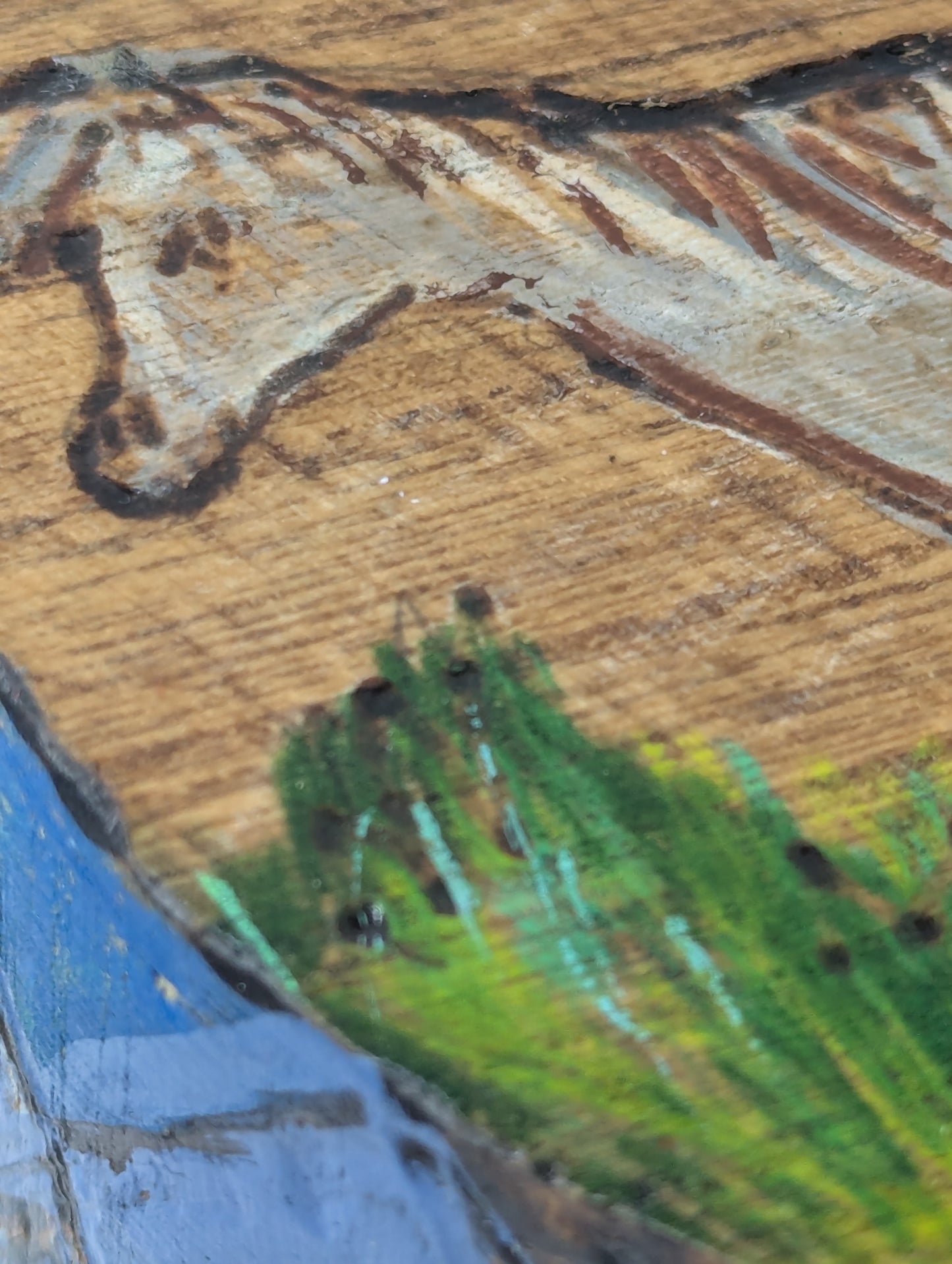 Close up of a decorative round wooden box with a tole painted horse 