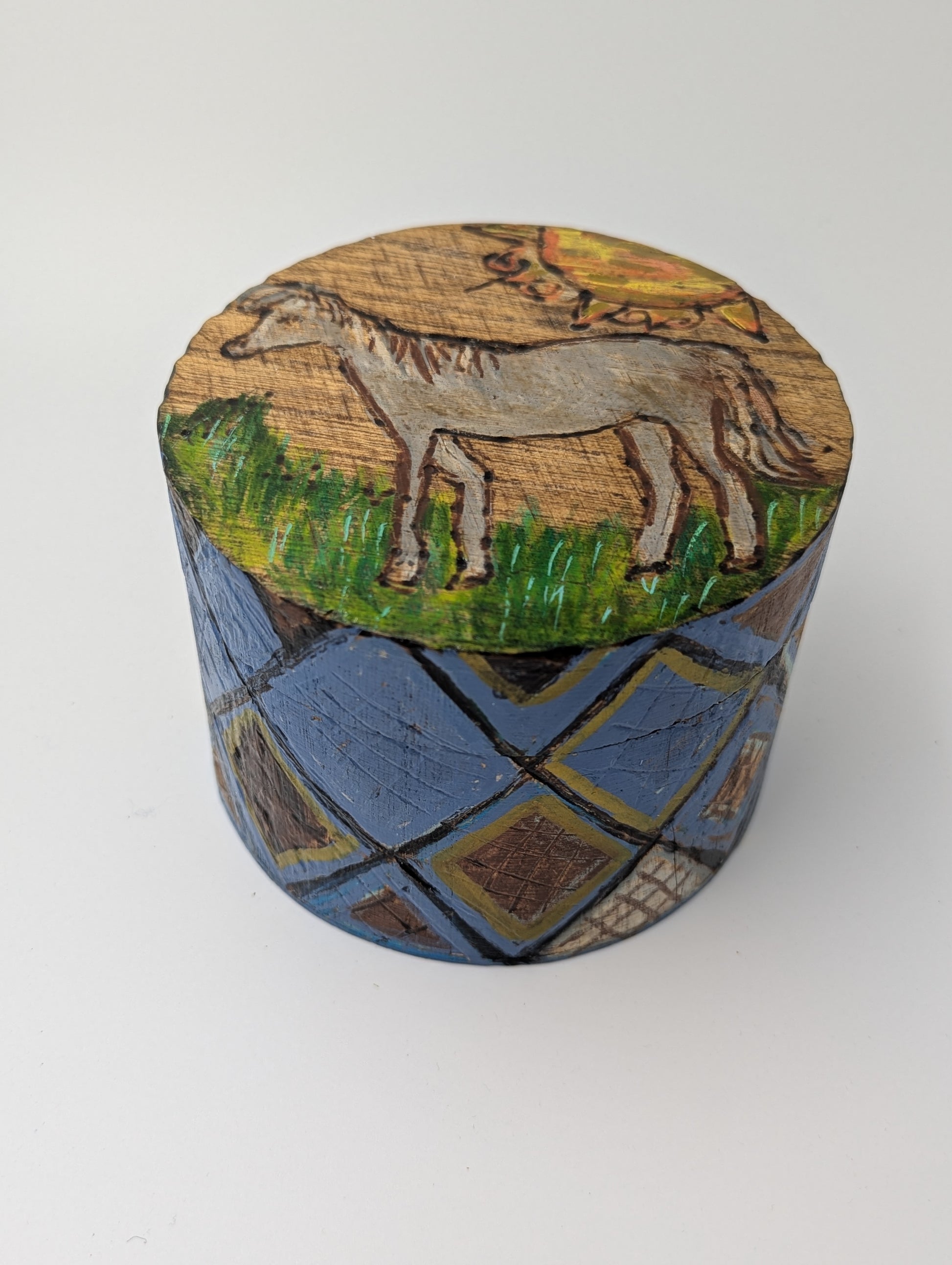 Decorative round wooden box with a tole painted horse 