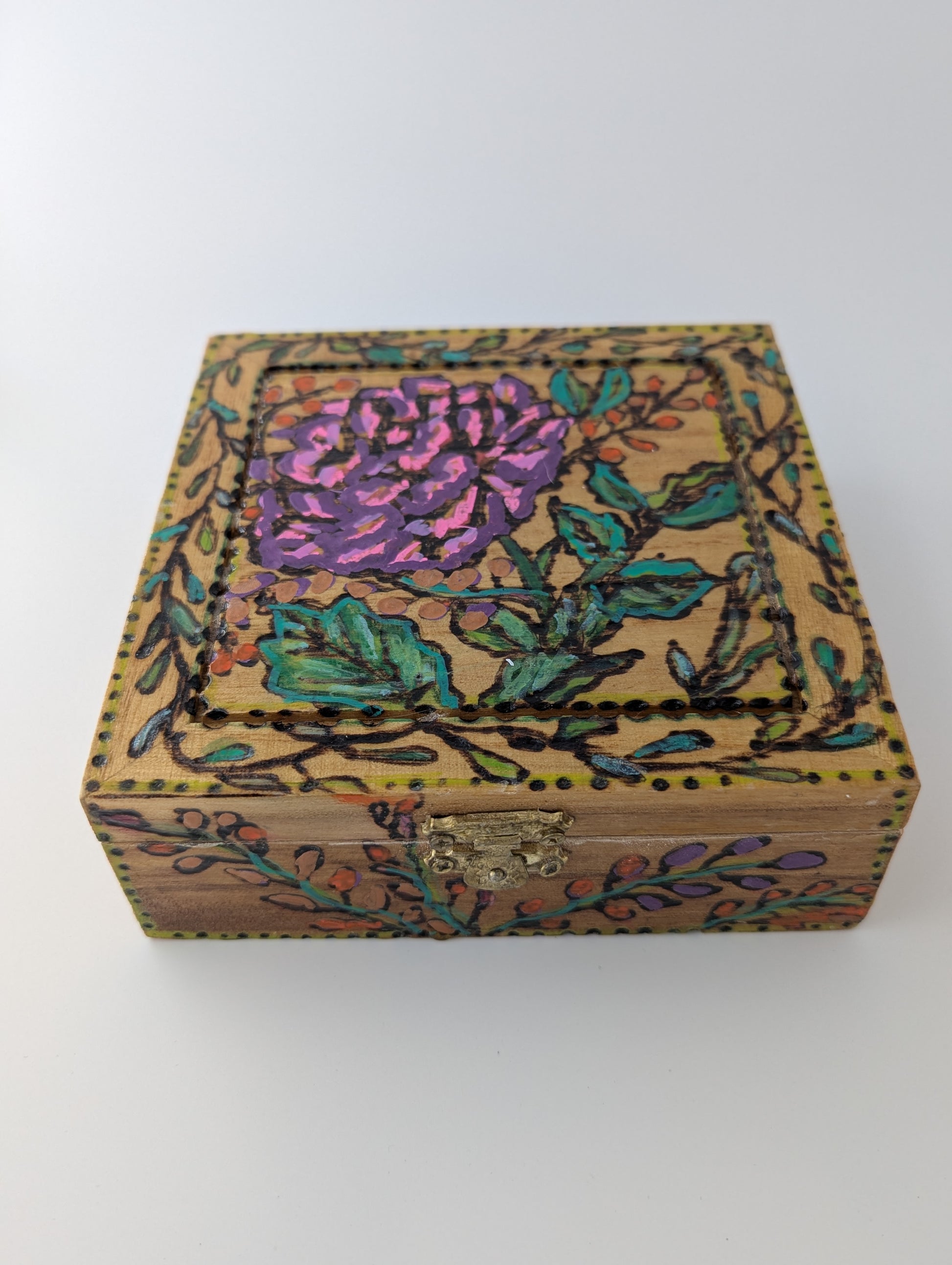 Decorative wooden box with a rose and floral pattern
