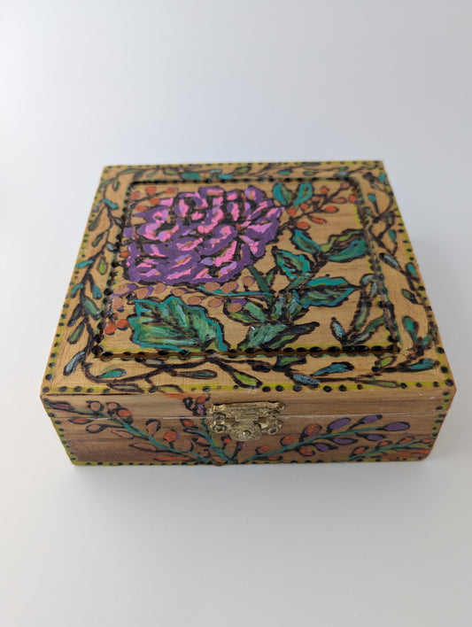 Decorative wooden box with a rose and floral pattern