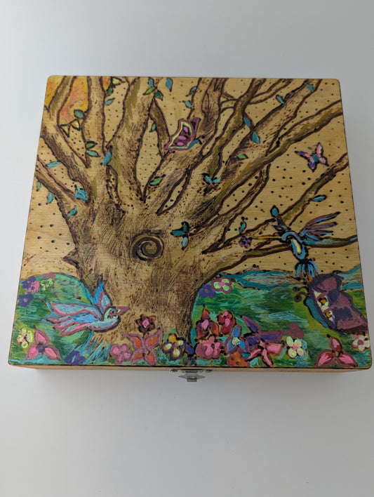 Decorative wooden box with a springtime design of a tree, birds, butterflies, and flowers 