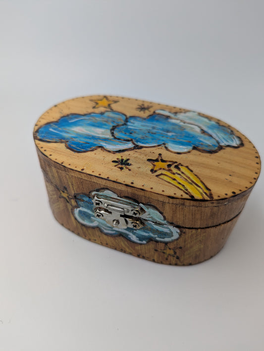 Decorative wooden box with cloud and star designs
