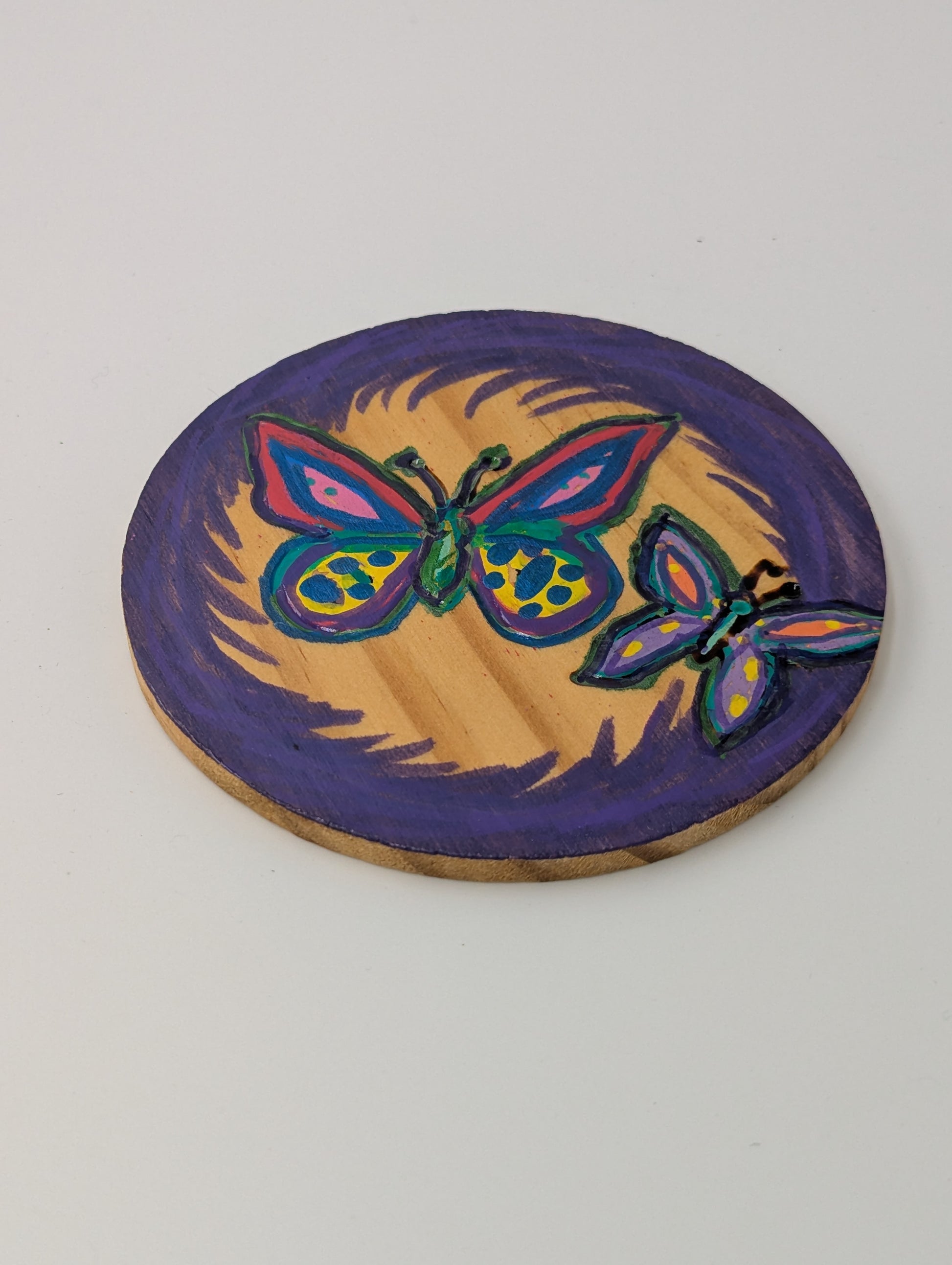 Wood burned and tole painted coaster with a butterfly design