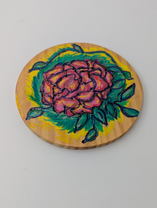 Wood burned and tole painted coaster with a rose design