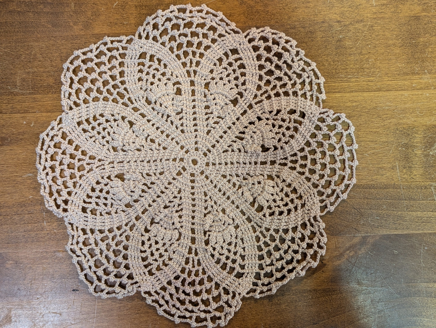 Crochet doily in a flowers and lace pattern.