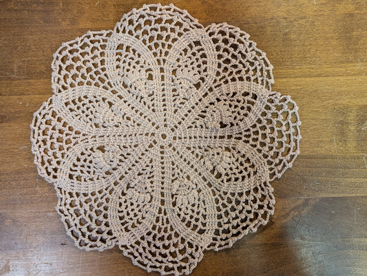 Crochet doily in a flowers and lace pattern.