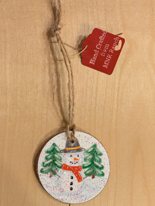 A handcrafted frosty the snowman ornament