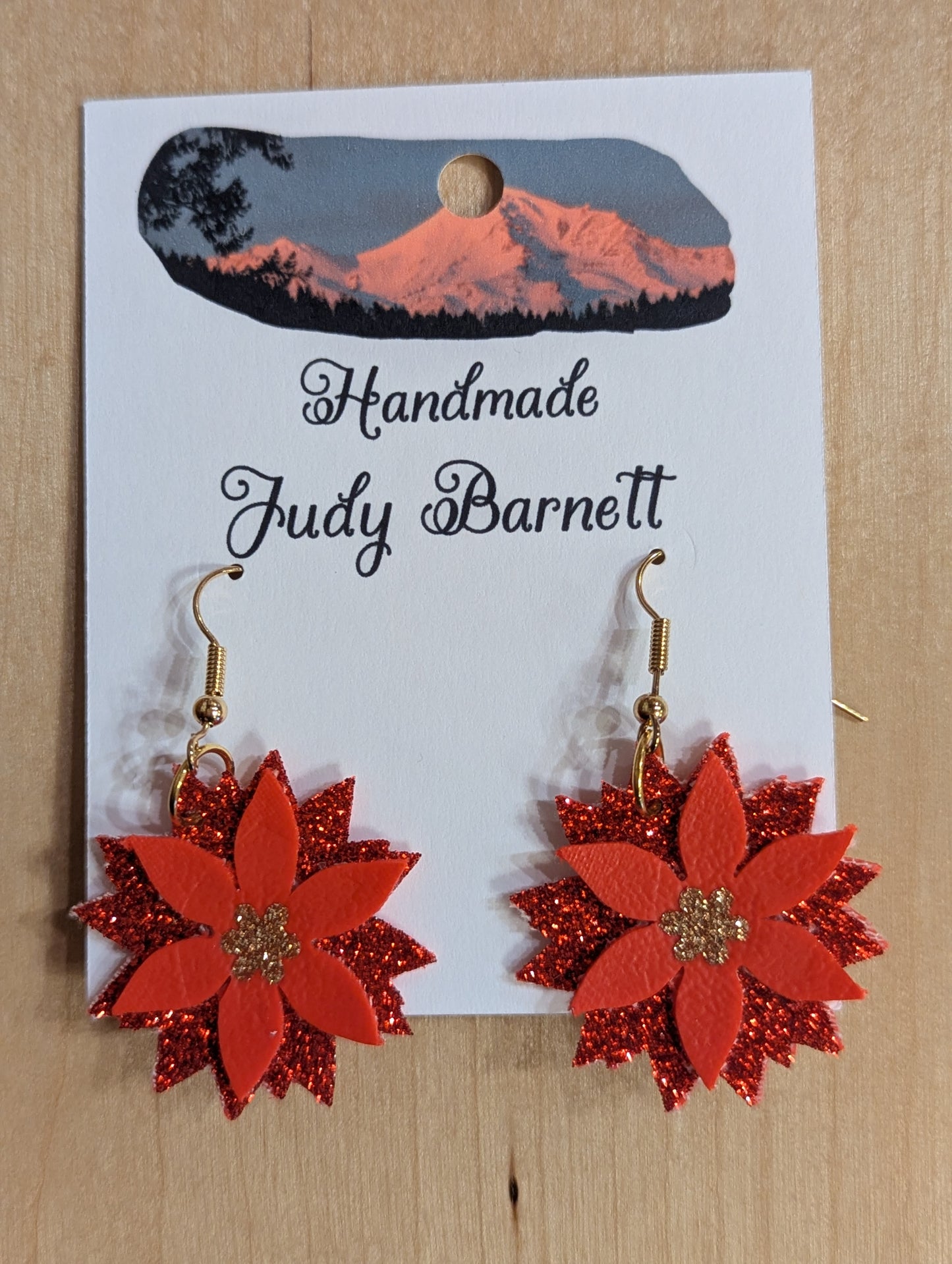 Red poinsettia earrings made of paper with gold hooks