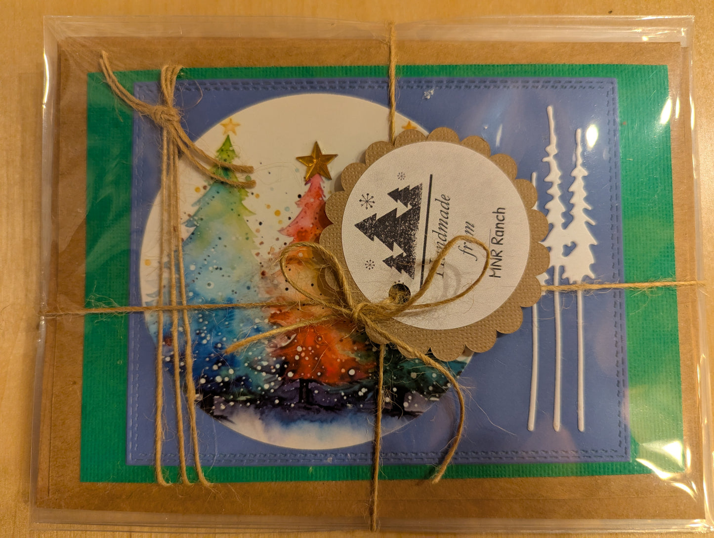 Hand made Christmas holiday greeting cards, set of 4, blank inside for your greetings. Bright watercolor trees and silhouettes create a festive mood.