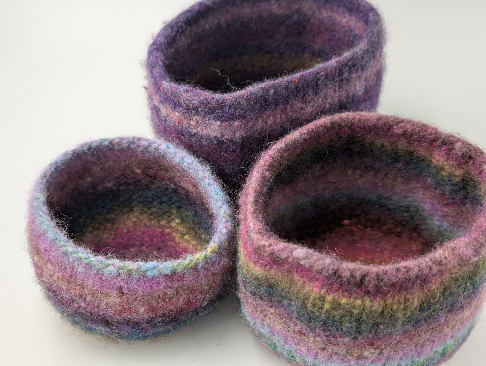 Three heather flower colored felted bowls