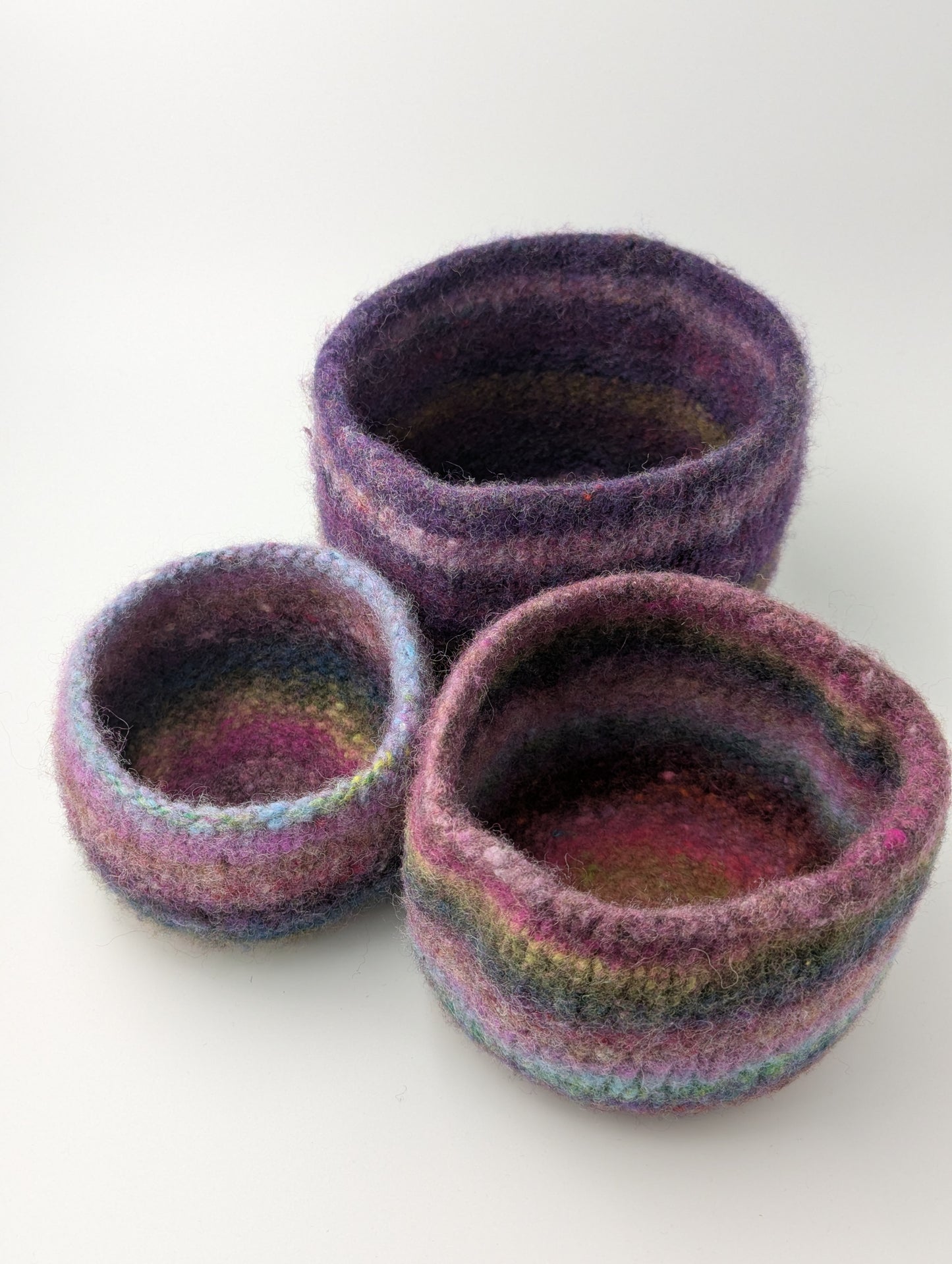 Three heather flower colored felted bowls