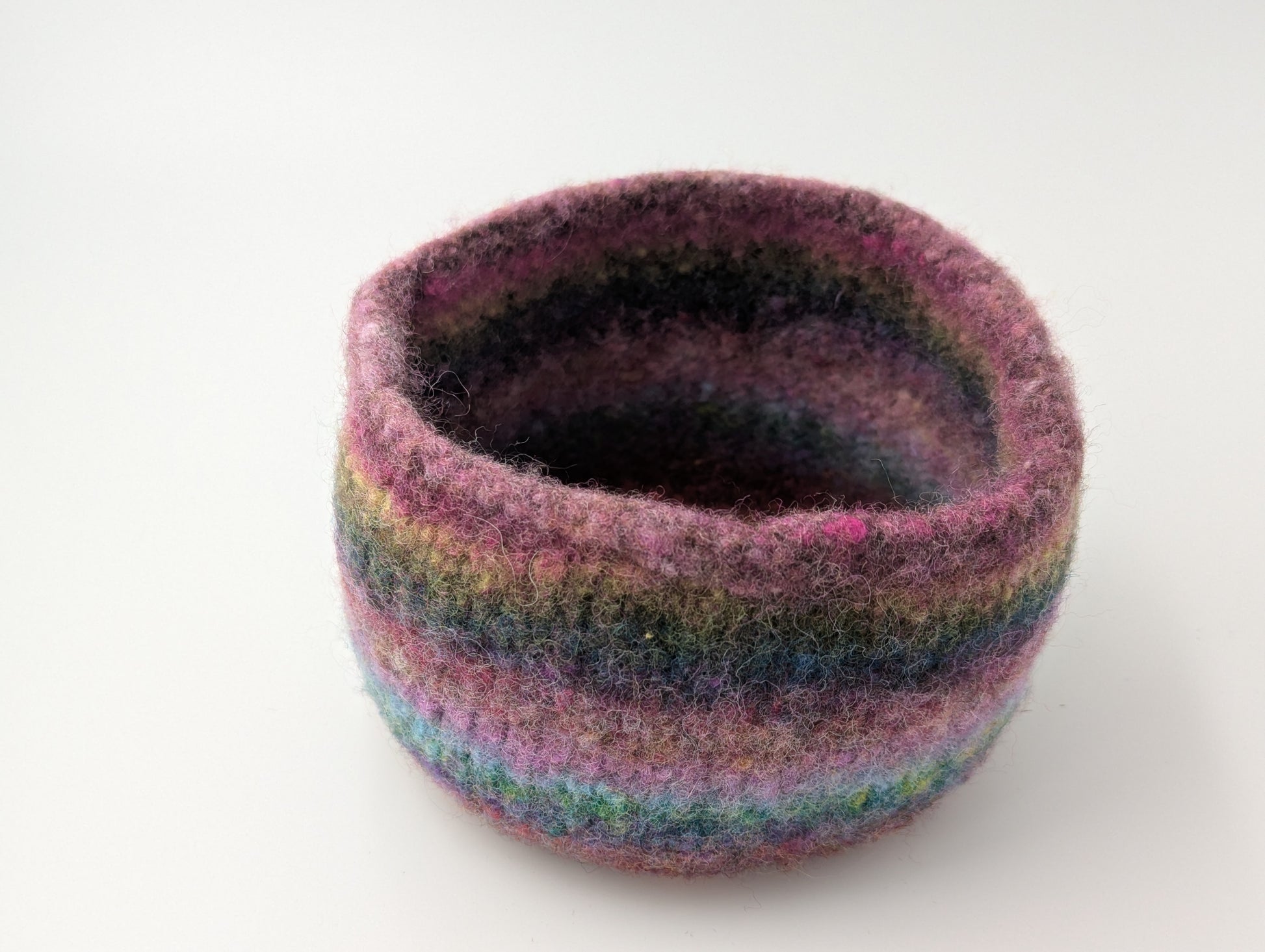 One of the three heather flower colored felted bowls