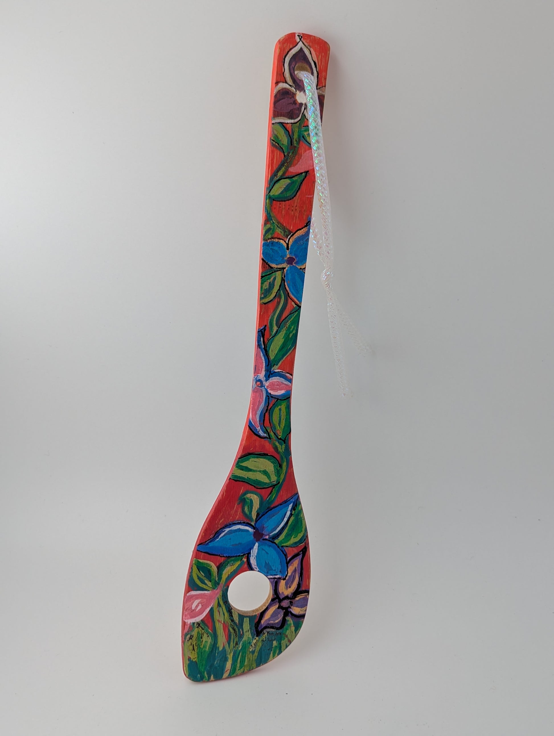 Colorful decorative wooden risotto spoon with floral patterns