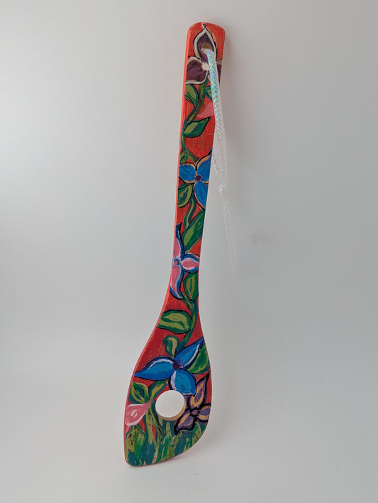 Colorful decorative wooden risotto spoon with floral patterns