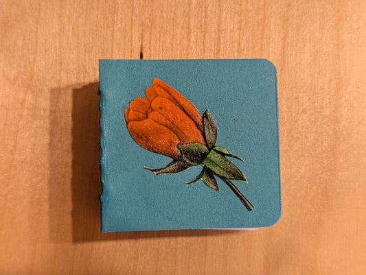 Hand bound journal. A beautiful rose adorns this sweet mini journal.
