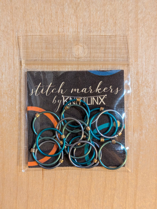 Knitting and crochet stitch markers by KnitLinx for knitting needles size 9 through 13. Made from metal in silver and blue colors.