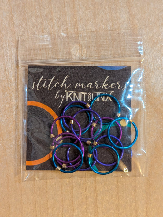 Knitting and crochet stitch markers by KnitLinx for knitting needles size 9 through 13. Made from metal in purple, blue and teal colors.