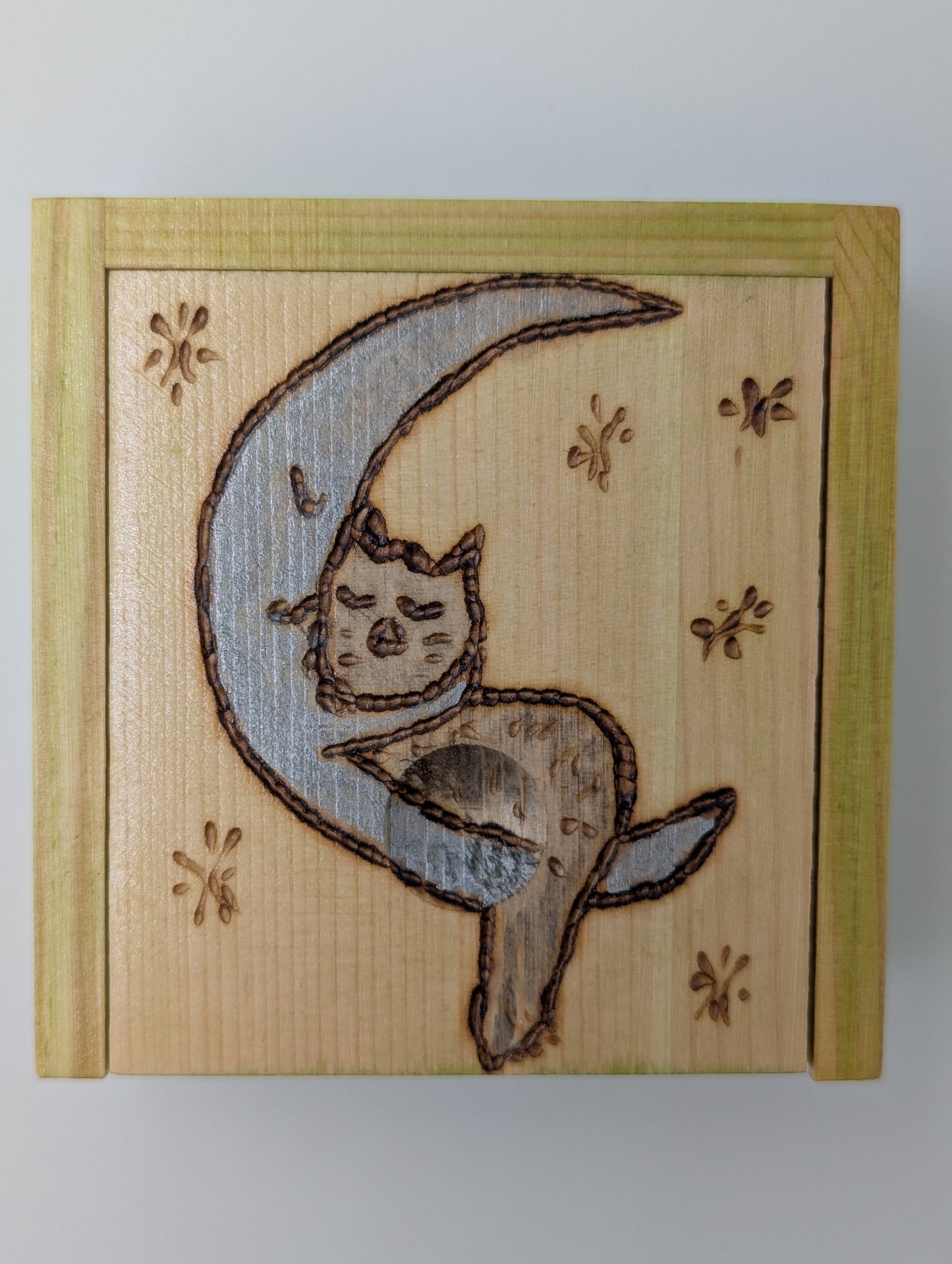 Wood-burned and hand painted trinket box featuring a blue crescent moon and gray cat.