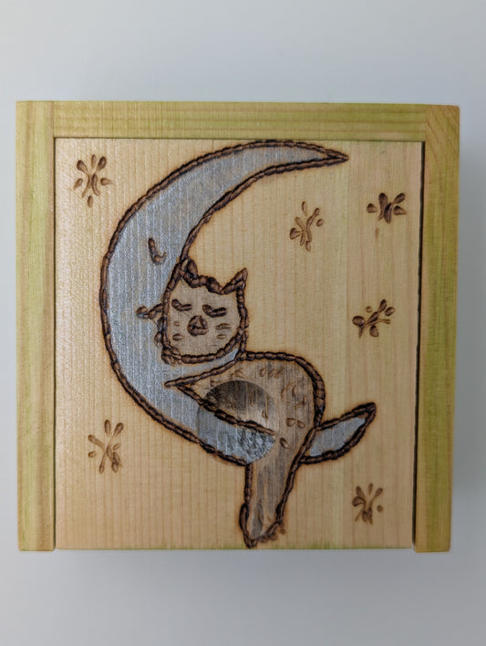 Wood-burned and hand painted trinket box featuring a blue crescent moon and gray cat.