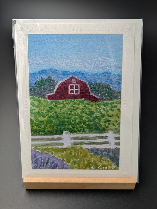 Hand drawn greeting card featuring a rural scene of a field and barn