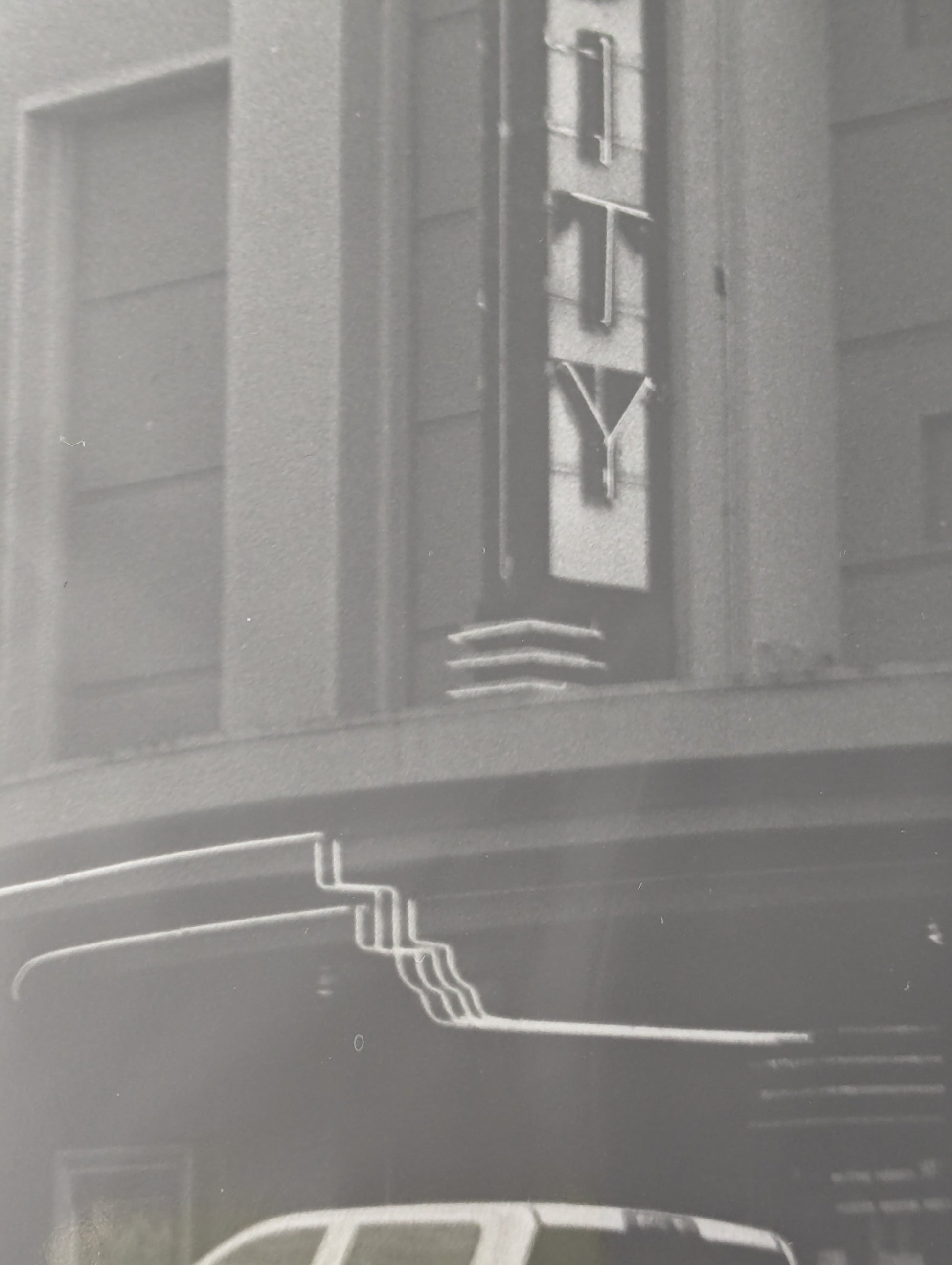 Close up of a black and white photo of the Varsity Theater in Ashland, Oregon