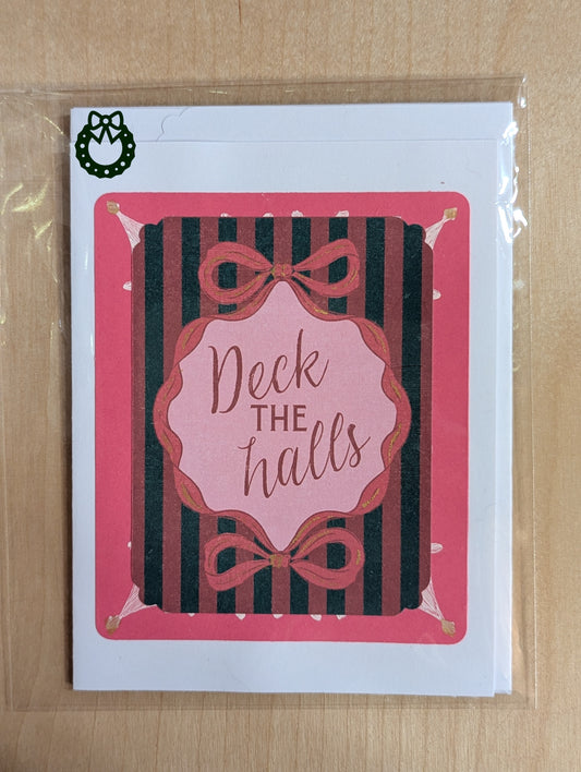Christmas card with 'Deck the halls' text and decorative bows on a striped background
