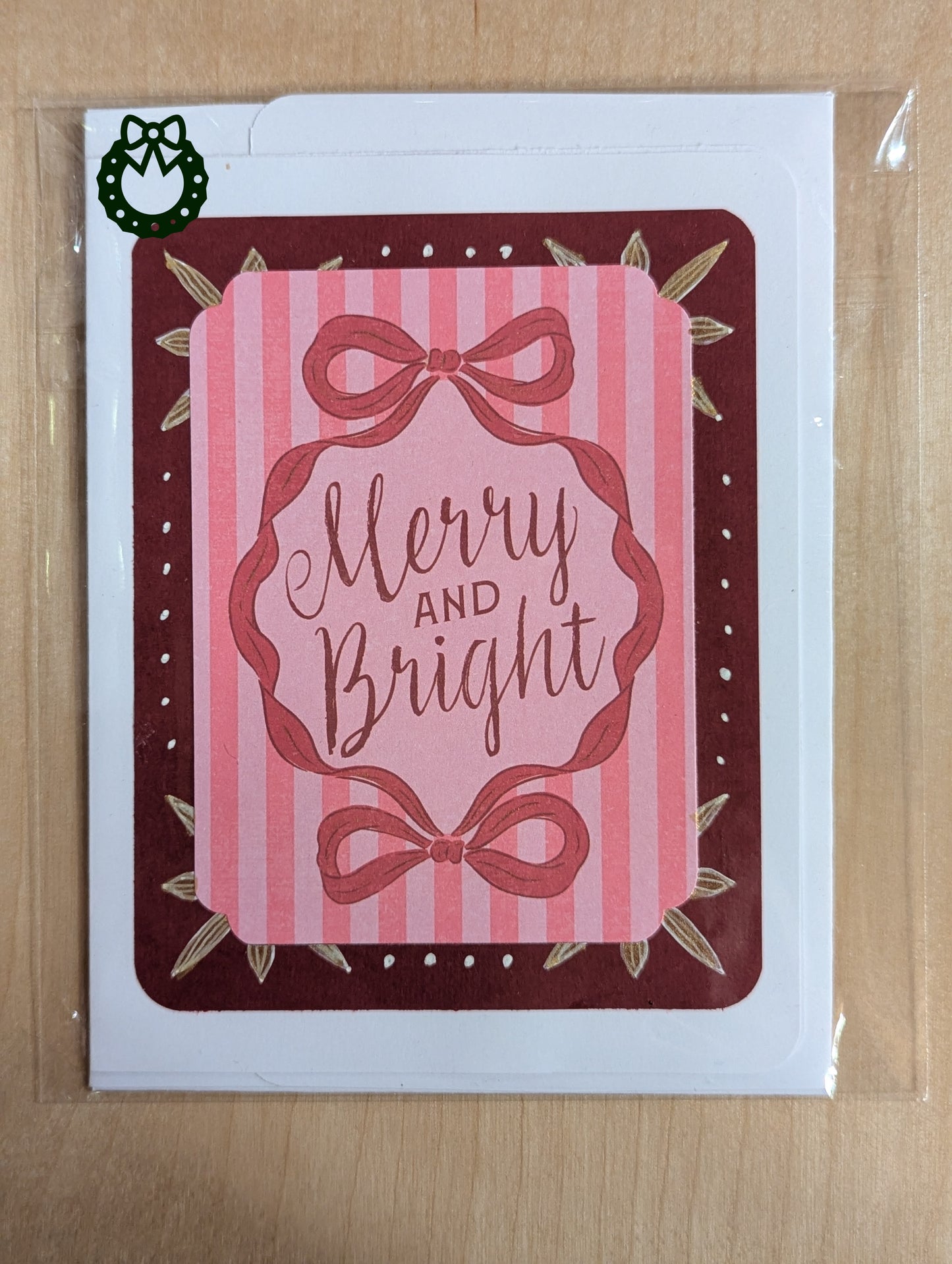 Retro style Christmas card saying 'Merry and Bright' on a pink stripped background