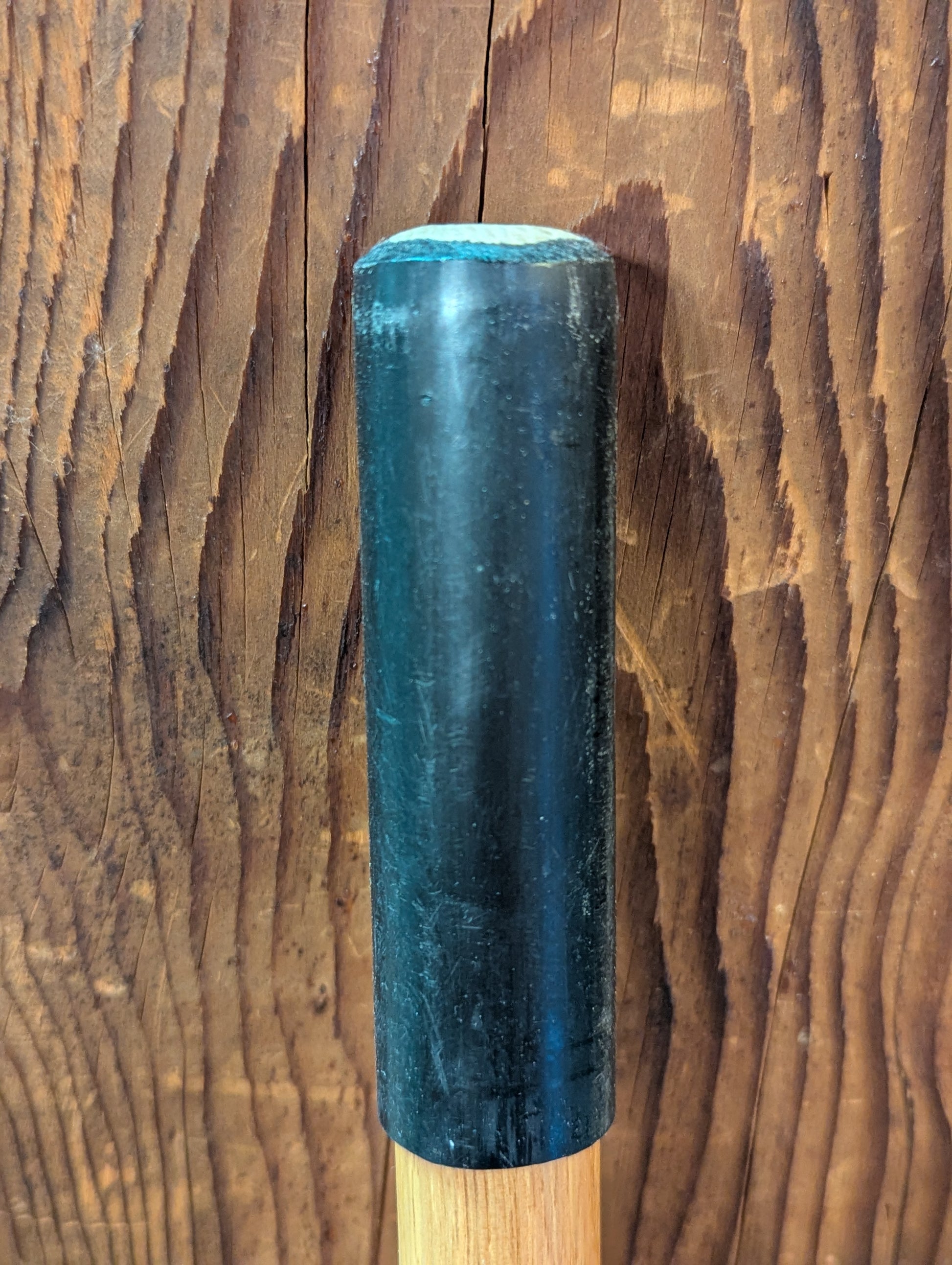 Detail of the bottom of a handcrafted fly fishing accessory to stabilize you while walking in water.