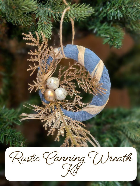 Rustic wreath ornament with blue flannel, raffia, and gold and white ornaments hanging on a tree with text overlay 'Rustic Canning Wreath Kit'