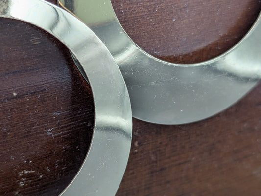 Close up of gold hoop earrings