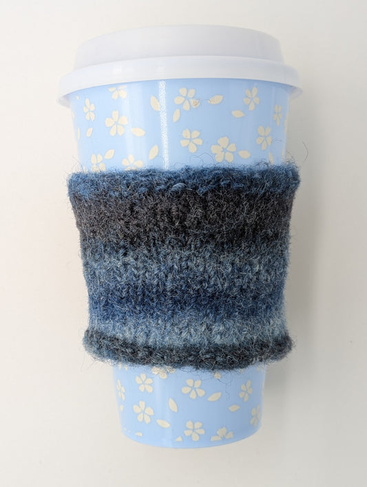 Knitted and felted blue and gray color gradient mug cozy