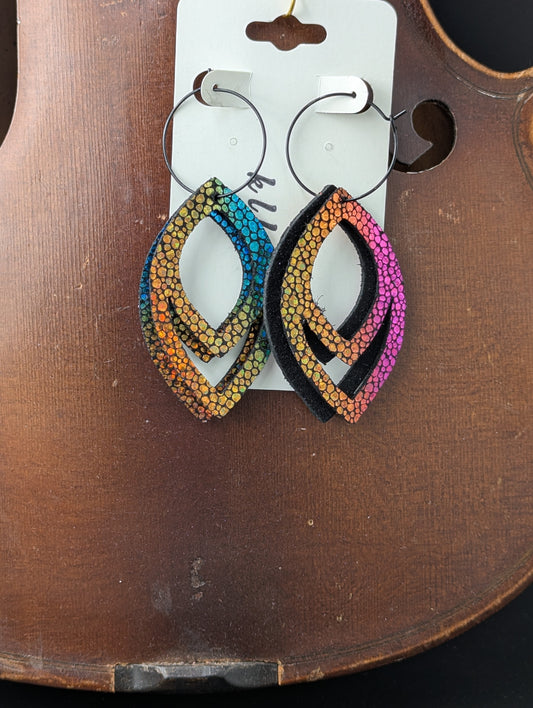 Deep iridescent drop shaped leather earrings on black hoops. 3 inches long.