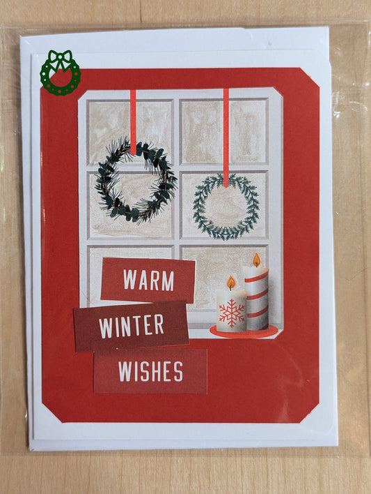 Christmas card with window scene, wreaths, and candles on a red background
