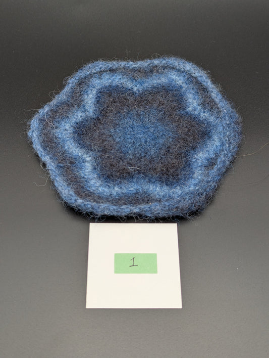 Blue hand knitted and felted coaster. This coaster is number 1.