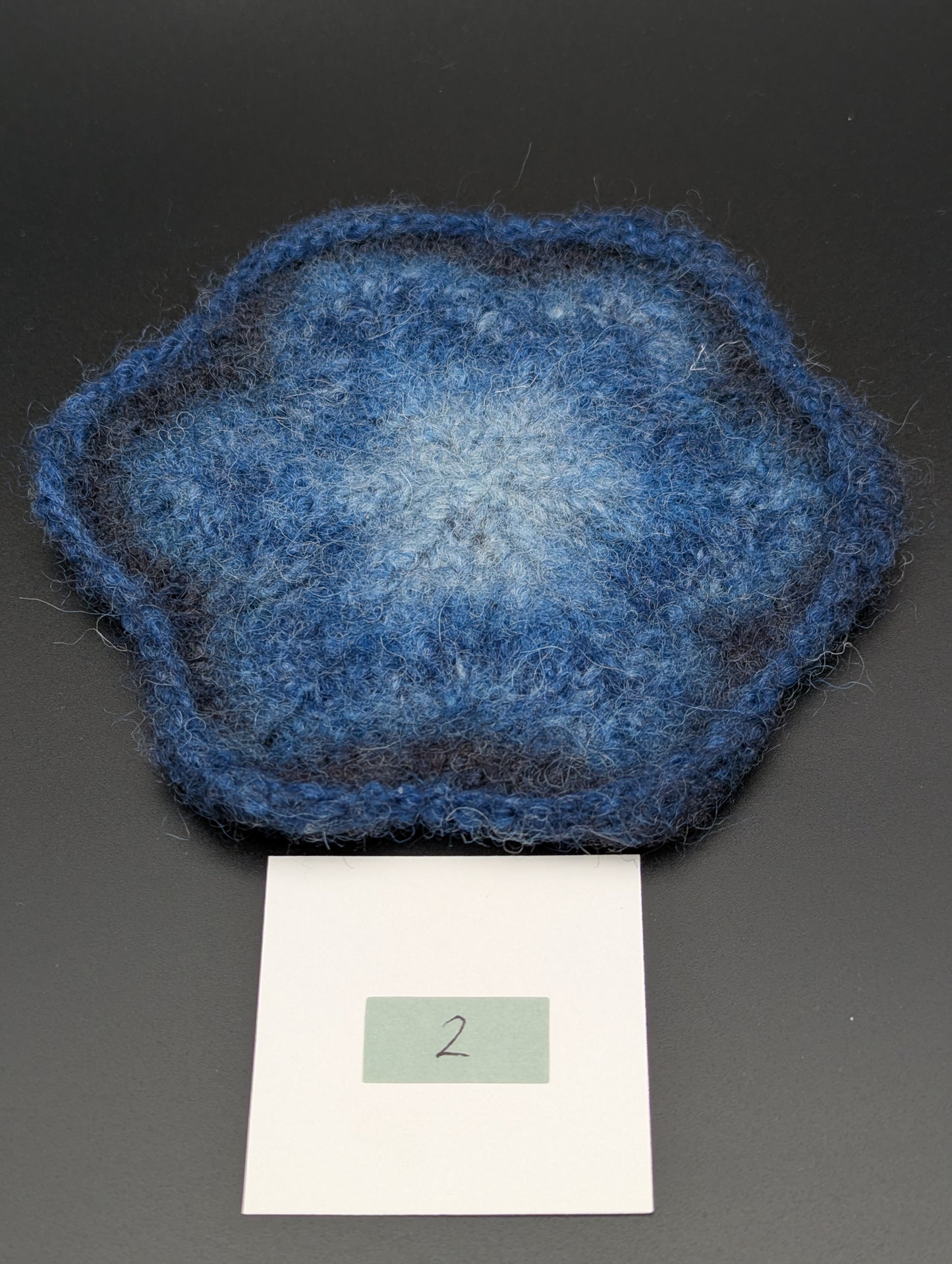 Blue hand knitted and felted coaster. This coaster is number 2.