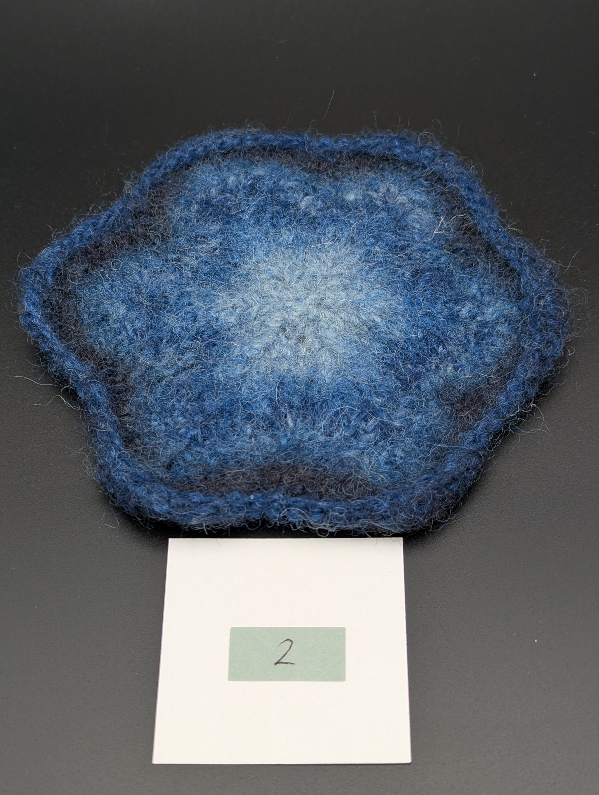 Blue hand knitted and felted coaster. This coaster is number 2.